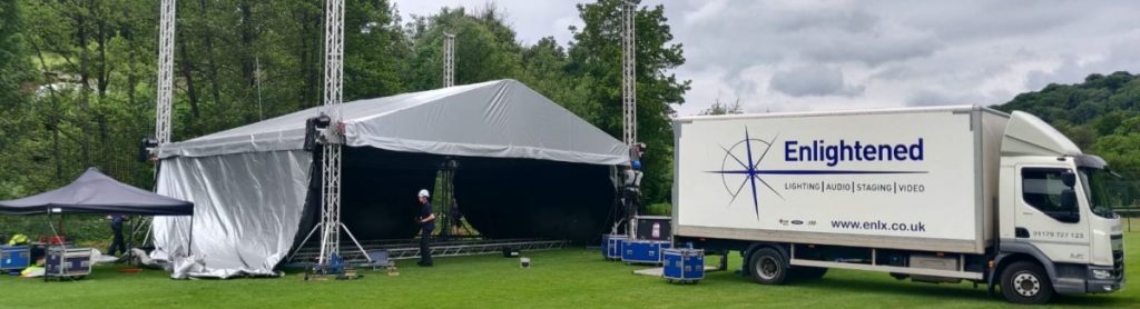 Outdoor festival stage with truck lorry delivery